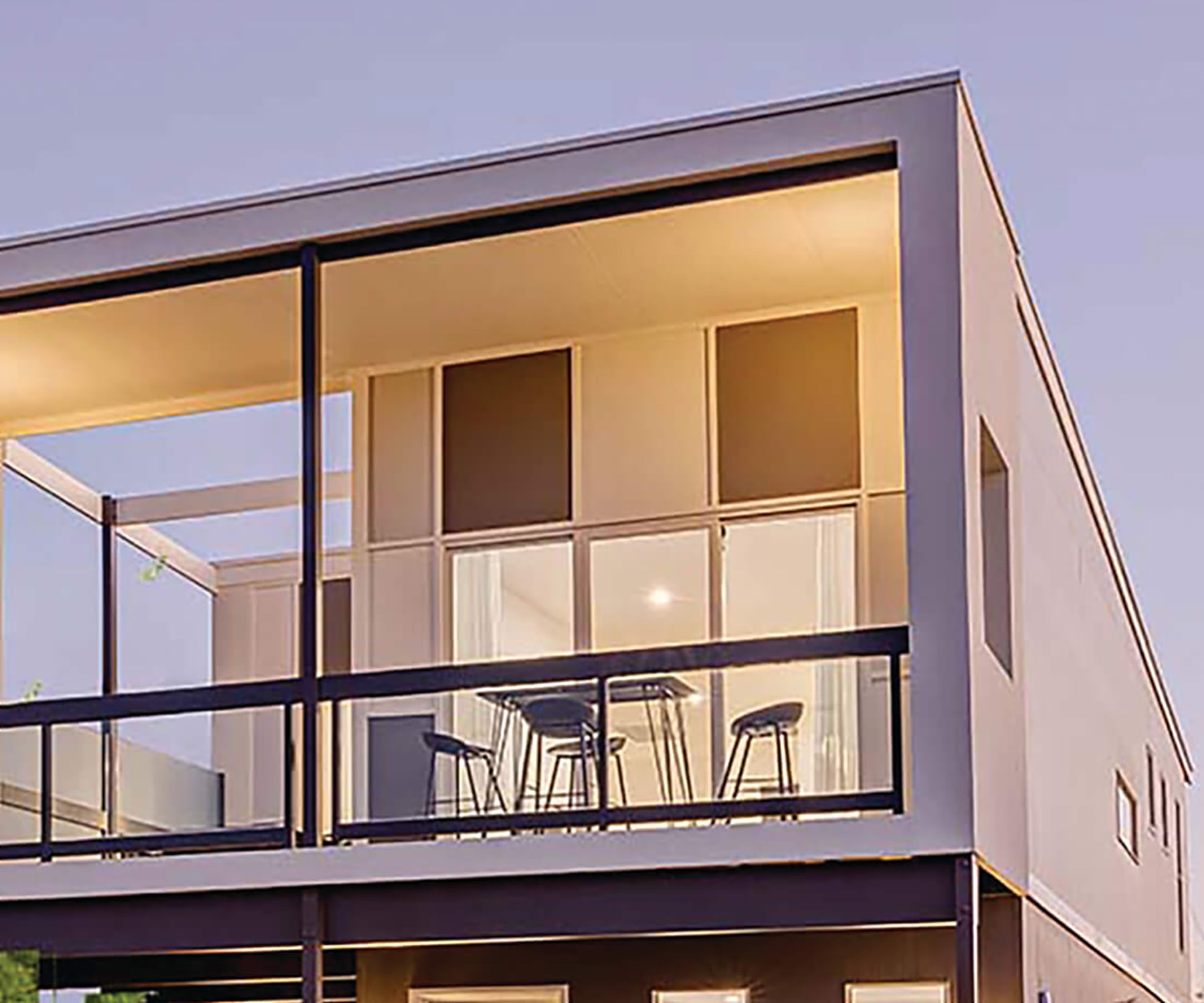 Upper balcony of the Gardenwood design lit at dusk